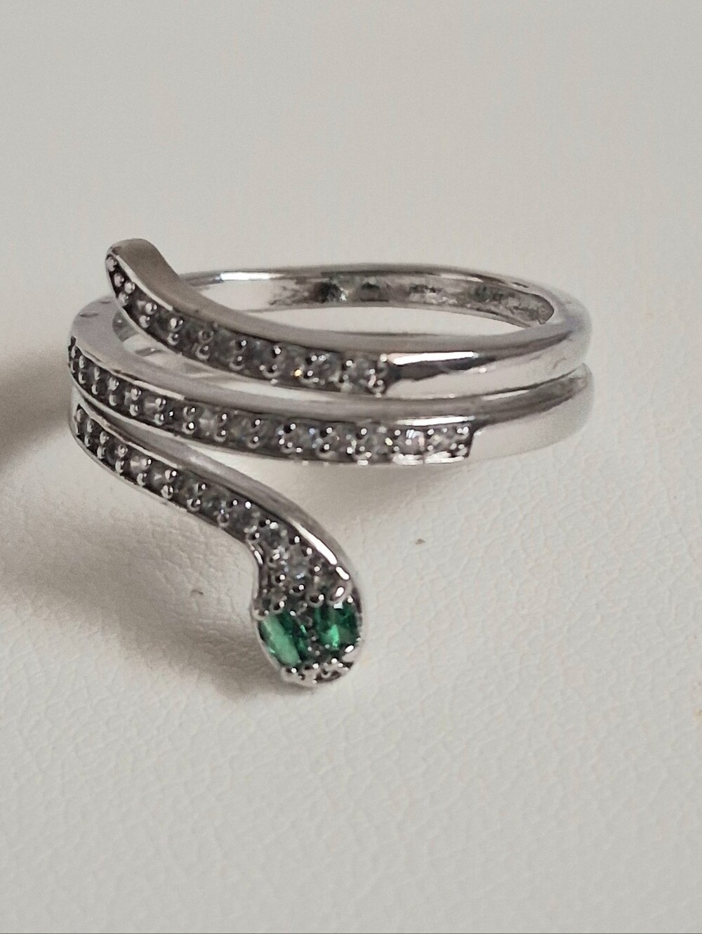 SILVER TONE SNAKE WRAP RING WITH EMERALD ACCENT